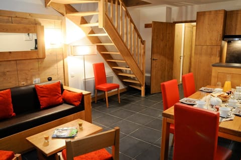 Prepare meals in the kitchenette and enjoy them at the dining table.