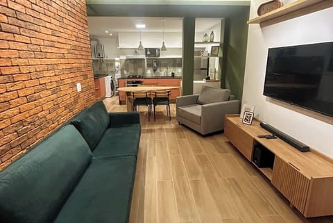 The apartment is open and totally integrated. The kitchen is integrated with the laundry room and the living room.