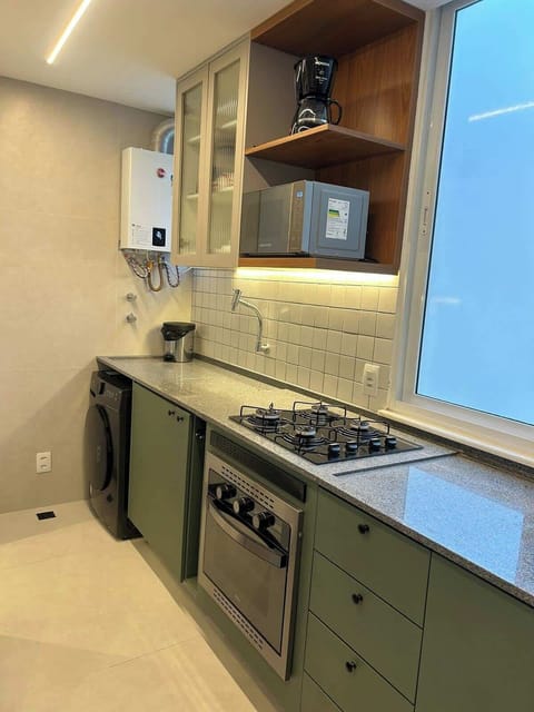 Gas stove, gas oven, microwave oven, filtered water. Combo washer/dryer