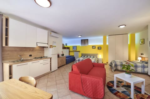 Family Studio, Kitchen, Ground Floor | Private kitchen | Full-size fridge, coffee/tea maker, cleaning supplies