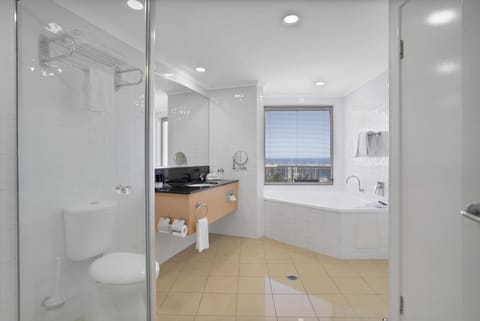 Deluxe Suite, 1 King Bed, Jetted Tub | Bathroom | Eco-friendly toiletries, hair dryer, towels, soap