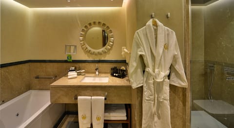 Royal Suite | Bathroom | Rainfall showerhead, designer toiletries, hair dryer, slippers