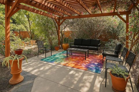 Relax under a pergola with vibrant bougainvillea overhead, enjoying hummingbirds by day and owls by night. Perfect for morning coffee or evening wine, this serene patio is an idyllic escape from the buzz of the city.