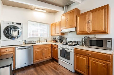 Sleek and Modern: Kitchen Equipped with great Appliances..