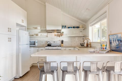 Barstool seating at the kitchen counter.