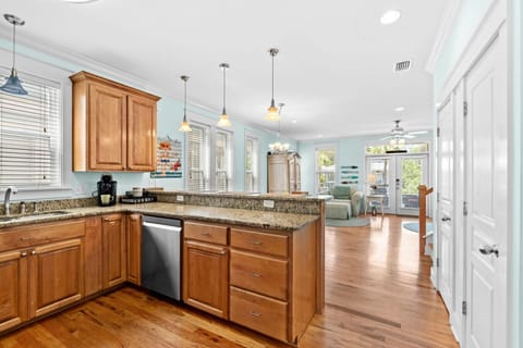 The spacious kitchen opens into the living area, creating the perfect setting for entertaining or relaxing with loved ones.