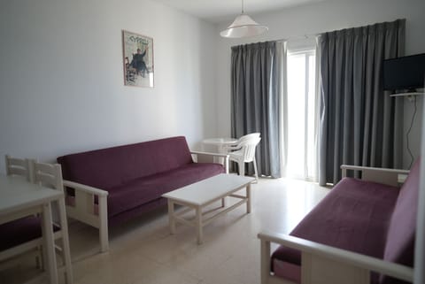 Apartment, 1 Bedroom, Partial Sea View | Living area | TV