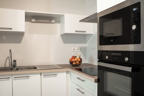 One-Bedroom Apartment | Private kitchenette | Fridge, microwave, coffee/tea maker, highchair