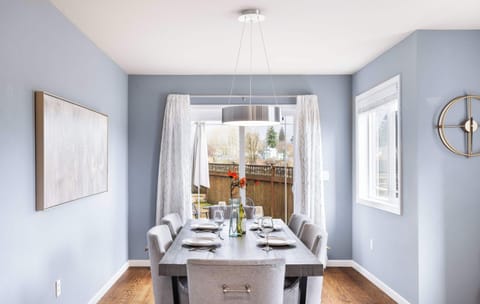 The dinning area is bathed in natural light from large slide door.