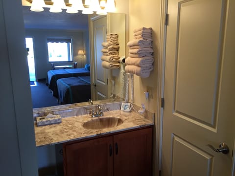 Standard Room, 2 Queen Beds | Bathroom | Hair dryer, towels