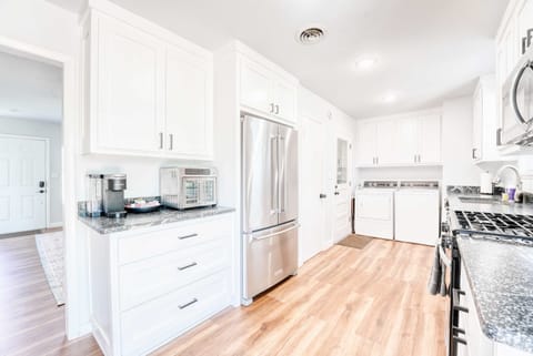Bright kitchen with stainless appliances, granite counters and all the cookware you need to whip up hearty meals.