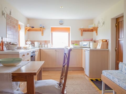 Furniture, Flooring, Wood, Interior Design, Floor, Cabinetry, Kitchen, Lighting, Room, Ceiling