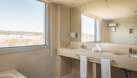 Junior Suite | Bathroom | Designer toiletries, hair dryer, towels, soap