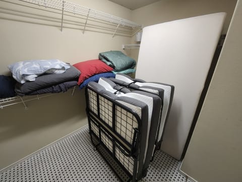 Two folding/rolling twin beds available in master closet.