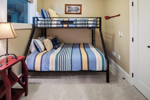 Third bedroom with a twin over double bunk bed