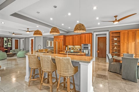 Gather around the island for coffee, cocktails, or conversation in this fully equipped chef’s kitchen