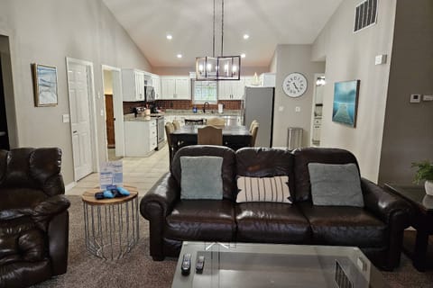 Living Room to Dining Room to Kitchen.