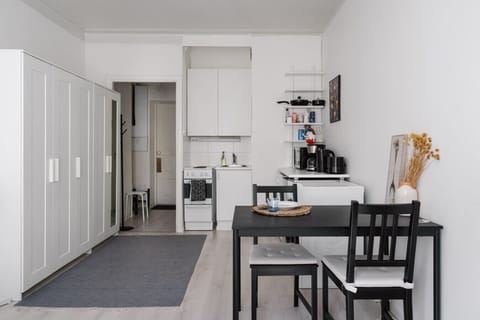 Gather around this cozy dining table, perfect for shared meals, casual work sessions, or late-night card games.