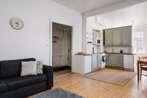 Enjoy the seamless flow between the spacious living room and the fully equipped open-concept kitchen