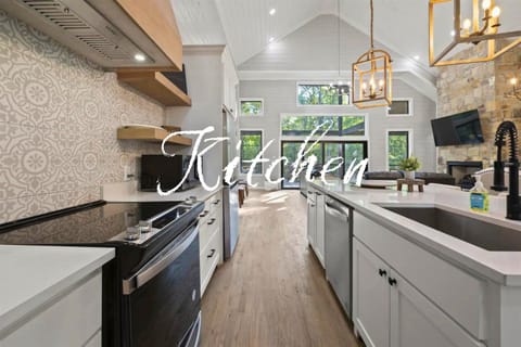 Our kitchen combines style and functionality, making it a perfect space for any chef to whip up delicious meals while enjoying the modern amenities.