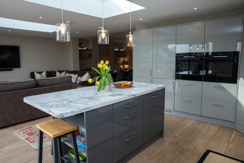Kitchen with island and double electric ovens