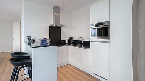 Apartment (Pharos Sea Pearl Terrace) | Private kitchen | Fridge, dishwasher, cookware/dishes/utensils