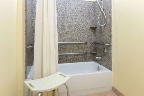 Combined shower/tub, designer toiletries, hair dryer, towels