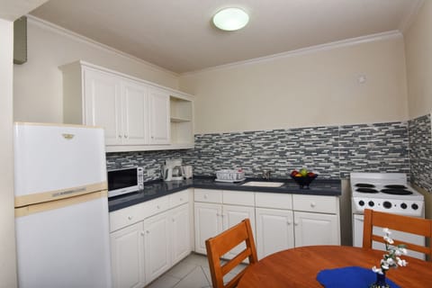 Standard Apartment, 1 Bedroom, Ocean View | Private kitchen | Full-size fridge, microwave, oven, stovetop