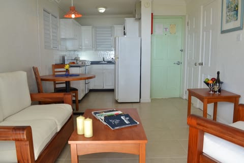 Standard Apartment, 1 Bedroom, Ocean View | Living area | 32-inch flat-screen TV with cable channels, TV