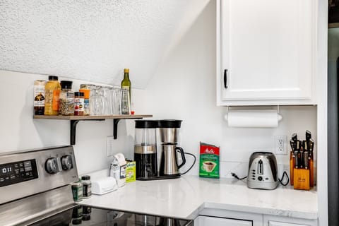 Kitchen is small but includes all the ameities