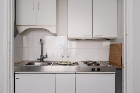 Our fully-equipped kitchen is compact yet efficient, offering everything you need to prepare a quick meal or enjoy a cup of coffee.