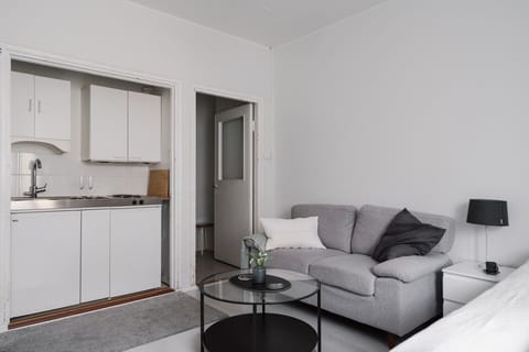 The sofa is your ideal spot for relaxation, offering plenty of comfort to enjoy a movie on the flat-screen TV or simply kick back and unwind.