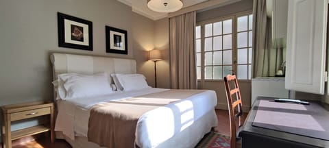 Premium bedding, individually furnished, desk, laptop workspace