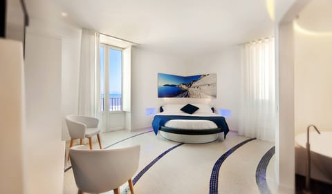 Junior Suite, 1 Bedroom, Sea View | Pillowtop beds, minibar, in-room safe, individually decorated