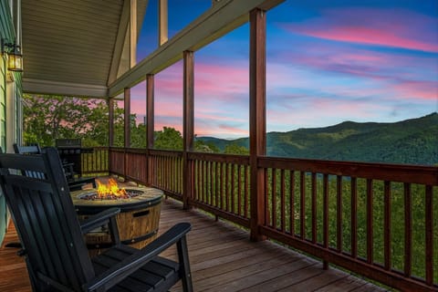 Twilight deck retreat with cozy firepit and panoramic Smoky views
