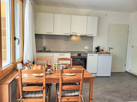 Furniture, Interior Design, Flooring, Kitchen, Floor, Wood, Major Appliance, Kitchen Appliance, Room, Cabinetry