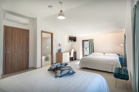 Quadruple Room, City View | Desk, laptop workspace, free WiFi