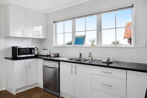 The main kitchen has everything you need to create meals including a oven, cooktop, dishwasher, fridge/freezer and microwave.