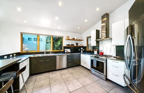 The spacious chef’s kitchen is fully equipped with abundant cooking essentials!