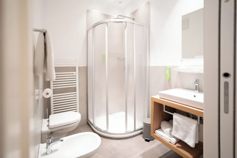 Triple Room | Bathroom | Shower, hair dryer, towels, soap