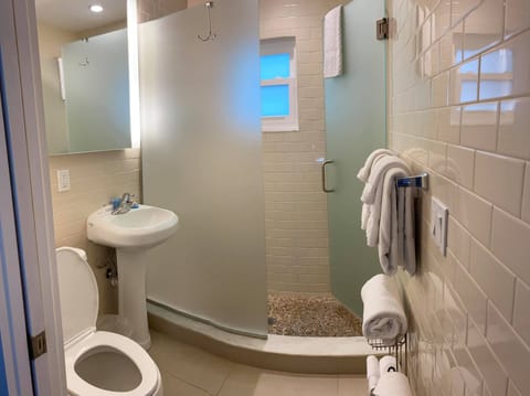 Sunset Studio | Bathroom | Shower, free toiletries, towels