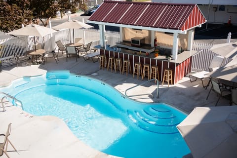 Seasonal outdoor pool, open 10:00 AM to 8:00 PM, sun loungers