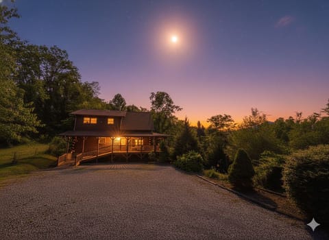 Moonlit nights and cozy cabin lights. Your mountain escape awaits.