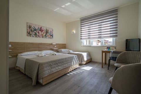 Family Triple Room, Ensuite, City View | Premium bedding, memory foam beds, minibar, laptop workspace