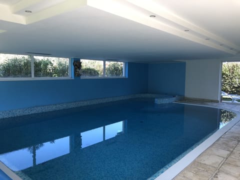 Indoor pool, outdoor pool, pool umbrellas, sun loungers