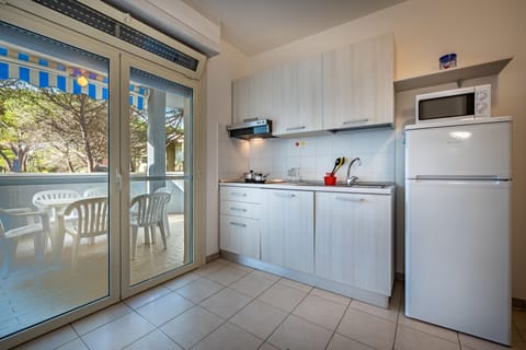 Apartment, 2 Bedrooms | Private kitchenette | Microwave, stovetop, highchair, cookware/dishes/utensils