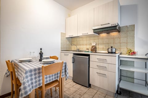 Apartment, 1 Bedroom | Private kitchen | Microwave, stovetop, highchair, cookware/dishes/utensils