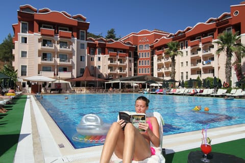 Outdoor pool, open 8 AM to 7 PM, pool umbrellas, sun loungers