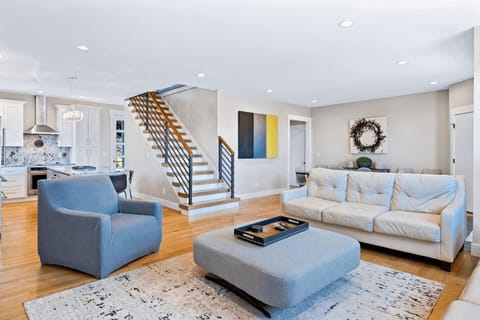 Designed for everyday living, this light-filled living room blends functionality with warmth, featuring custom finishes and thoughtful touches.