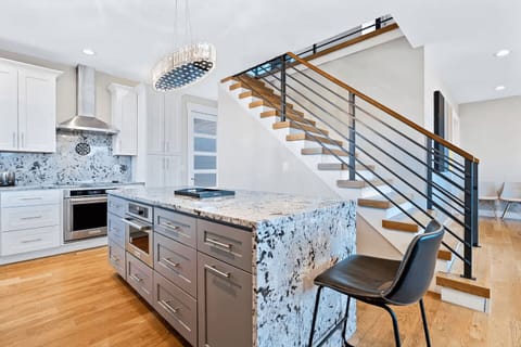 A chef’s dream, this open-concept kitchen combines contemporary design with smart appliances and elegant details for ultimate cooking ease.